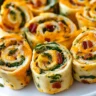 Cheddar Bacon Ranch Pinwheels served on a platter, perfect for parties