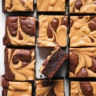 Delicious homemade brownies with a creamy peanut butter swirl, ready to enjoy.