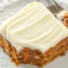 Moist carrot cake with pineapple and walnuts topped with cream cheese frosting.
