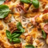 Gluten-free cauliflower crust pepperoni pizza with cheese and fresh toppings.