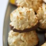 Coconut macaroons made with sweetened condensed milk on a baking sheet.