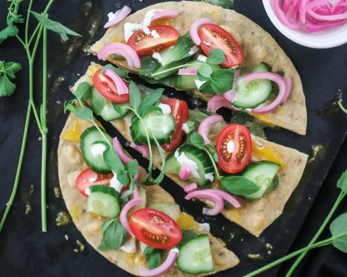 Mediterranean cucumber spinach flatbread wrap filled with fresh vegetables and herbs