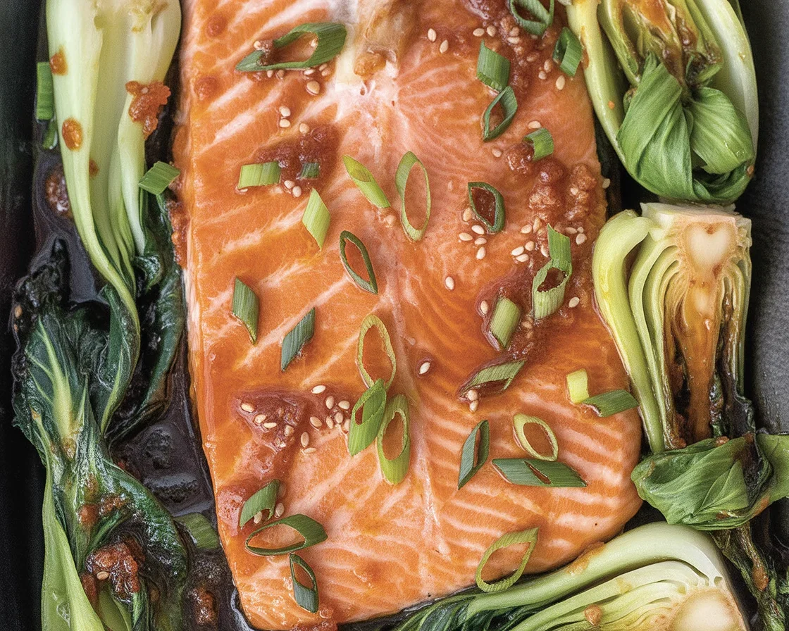 Sheet pan salmon bok choy served over fluffy rice, ready to eat.