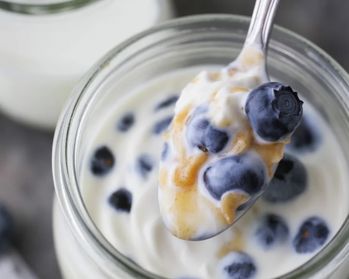 Steel-cut overnight oatmeal jars with almond milk and fresh toppings.